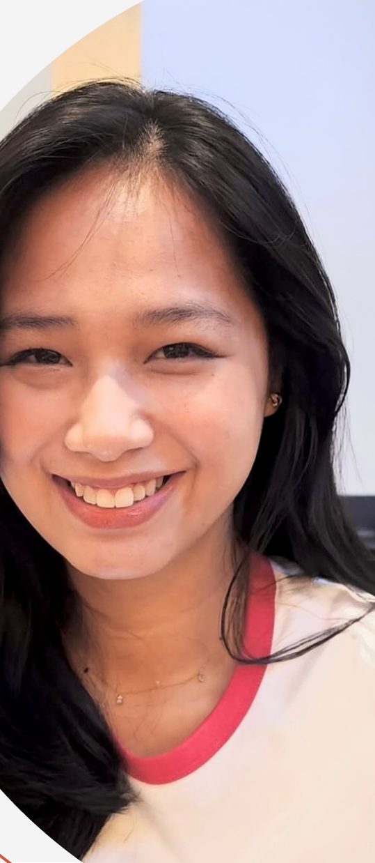 Maria Pe smiling, in a white top